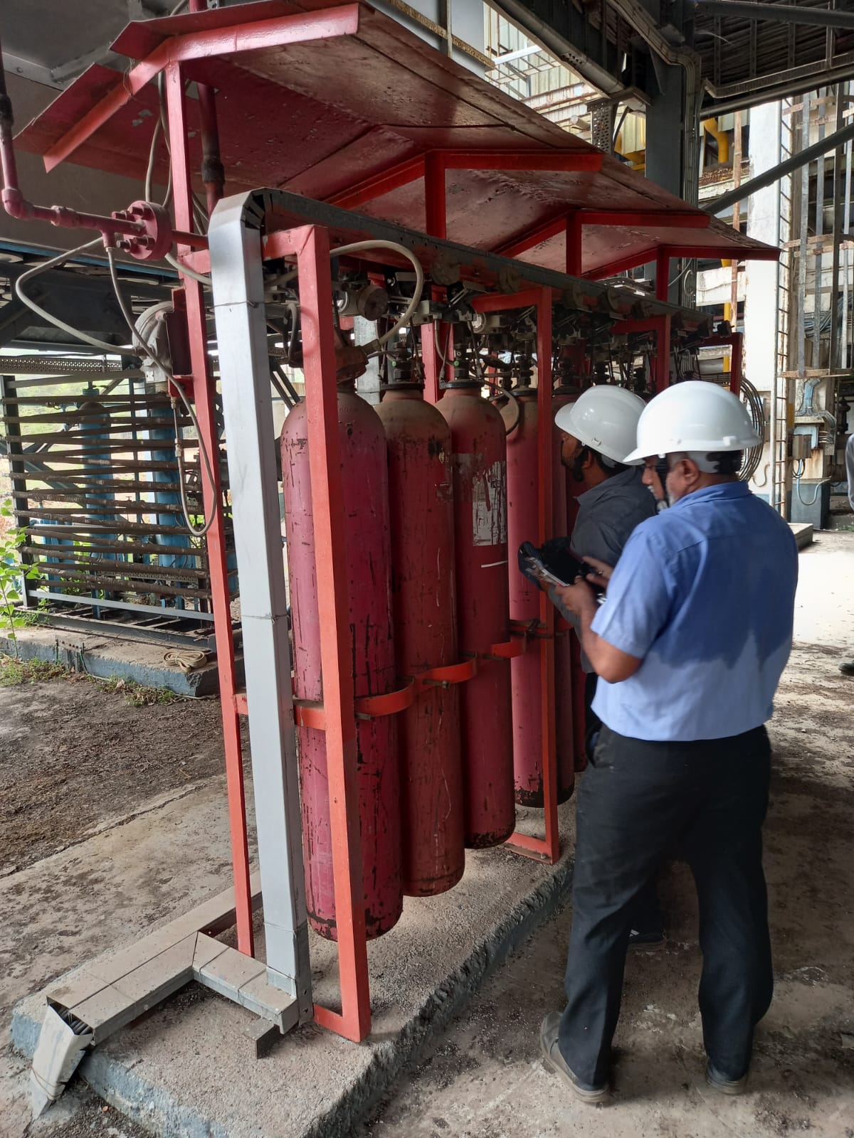 Installed fire hose reel and extinguisher setup